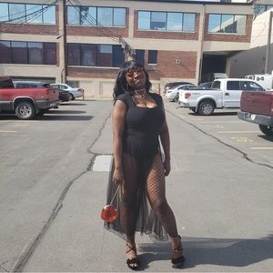 Women’s black bodysuit with button closure